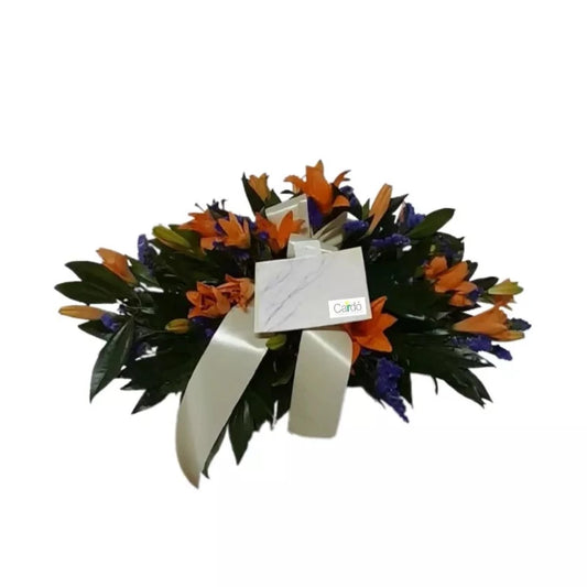 Ramo fúnebre. Sobre cofre con flores exóticas - SF51